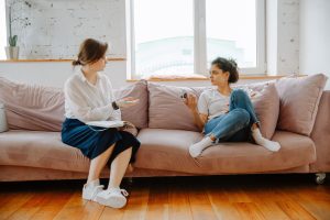 Woman in session with a relationship counsellor discussing issues on a couch